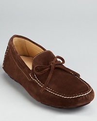 Treat your feet to this luxe suede loafer, finished with a stitched moc toe and tie detail at the tongue. Treat your feet to this luxe suede loafer, finished with a stitched moc toe and tie detail at the tongue.