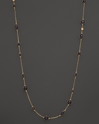 Round and oval grey enamel stations and a diamond highlight this gold chain necklace. Round and oval grey enamel stations and a diamond highlight this gold chain necklace.