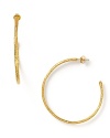 Alexis Bittar's simple textured hoops are the perfect accent to your look, day or night.