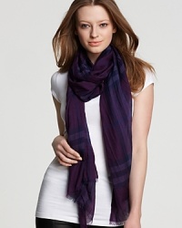 A large, sheer oblong scarf featuring a bright violet check pattern from Burberry.