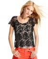 A ladylike classic gets a downtown makeover: INC's sheer lace tee makes layering look wildly alluring.