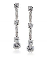 Give your image a little extra twinkle. These dramatic drop earrings by Carolee feature four large, round-cut crystals with eight round-cut crystal accents. Crafted in silver-plated mixed metal with surgical steel posts. Approximate drop: 1-1/2 inches. Give your image a little extra twinkle. These dramatic drop earrings by Carolee feature four large, round-cut crystals with eight round-cut crystal accents. Crafted in silver-plated mixed metal with surgical steel posts. Approximate drop: 1-1/2 inches.