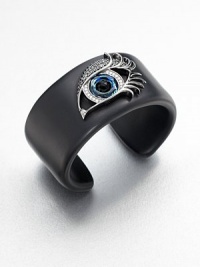 From the Envy Collection. The eyes have it in this striking cuff of jet black resin, dramatically adorned with a sweeping silver-outlined eye that gazes and glitters intently, set with cubic zirconia and black onyx.Black onyxBlack, white and blue cubic zirconiaSterling silverResinDiameter, about 2.25Imported