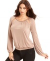 Chain hardware and cutouts add a glam appeal to this GUESS top -- perfectly paired with skinny jeans for a hot soiree look!