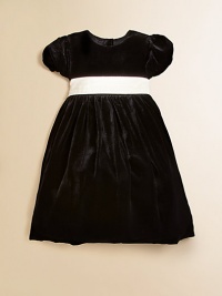 A luxuriously plush velvet dress is highlighted with pretty puffed sleeves, a full skirt and a taffeta sash for a stylish holiday look.BoatneckShort puffed sleevesBack buttonsEmpire waist with taffeta sashFull skirt with tulle liningFully linedViscose/SilkDry cleanImported Please note: Number of buttons may vary depending on size ordered. A luxuriously plush velvet dress is highlighted with pretty puffed sleeves, a full skirt and a taffeta sash for a stylish holiday look.BoatneckShort puffed sleevesBack buttonsEmpire waist with taffeta sashFull skirt with tulle liningFully linedViscose/SilkDry cleanImported Please note: Number of buttons may vary depending on size ordered.