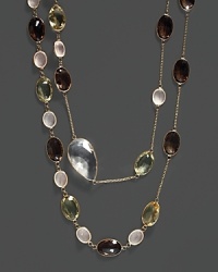 A mix of colorful quartz and clear crystal stations on a 14K yellow gold chain. A mix of colorful quartz and clear crystal stations on a 14K yellow gold chain.