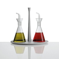 Oil and vinegar set in melamine, white. Designed by Dorianna e Massimiliano Fuksas. Oil and vinegar set in melamine, white. Designed by Dorianna e Massimiliano Fuksas.