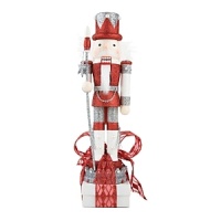 The Platinum Grande Nutcrackers shimmer and shine atop an assortment of red, white and black boxes. The Platinum Grande Nutcrackers shimmer and shine atop an assortment of red, white and black boxes.
