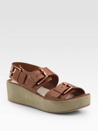 Soft leather defined by wide, rose goldtone buckles and a velvety suede platform. Suede platform, 1¾ (45mm)Leather upperLeather liningBuffed leather solePadded insoleImportedOUR FIT MODEL RECOMMENDS ordering true size. Soft leather defined by wide, rose goldtone buckles and a velvety suede platform. Suede platform, 1¾ (45mm)Leather upperLeather liningBuffed leather solePadded insoleImportedOUR FIT MODEL RECOMMENDS ordering true size.