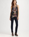 Abstract orchid print adds charm to this feminine top with a hi-lo hem and slightly open back. RoundneckSleevelessSplit hi-lo hemBack keyhole detail with button closuresPolyesterDry cleanMade in USA of imported fabricModel shown is 5'10 (177cm) wearing US size Small.