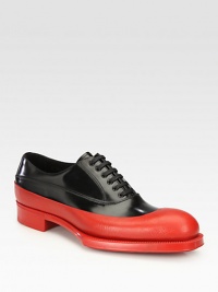 Lace-up style with dipped rubber design and exaggerated sole.Leather/rubber upperLeather liningRubber soleMade in Italy Lace-up style with dipped rubber design and exaggerated sole.Leather/rubber upperLeather liningRubber soleMade in Italy