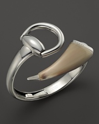A horn accent adds edge to Gucci's signature horsebit design in this sterling silver statement bangle. A horn accent adds edge to Gucci's signature horsebit design in this sterling silver statement bangle.