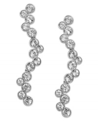 Timeless, feminine and graceful. Swarovski's rhodium-plated pierced earrings present a beautiful, fluid silhouette in sparkling clear crystal pavé. Set in mixed metal. Approximate drop: 1-5/8 inches.