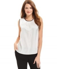 Calvin Klein updates this shell with contrasting trim at the neck and arms for a sharp look. Calvin Klein updates this shell with contrasting trim at the neck and arms for a sharp look.