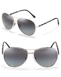 Classic aviator sunglasses with check wrapped temples and polarized lenses, an iconic style from Burberry. Classic aviator sunglasses with check wrapped temples and polarized lenses, an iconic style from Burberry.