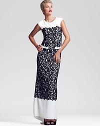 In a timeless black and white palette, BCBGMAXAZRIA's Loretta dress is luxe in lace--red lipstick serves as the perfect accessory. In a timeless black and white palette, BCBGMAXAZRIA's Loretta dress is luxe in lace--red lipstick serves as the perfect accessory.