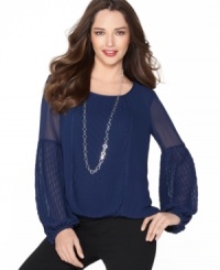 Studio M's blouse features sheer bishop sleeves and a luxe, diamond-shaped pattern through the front center and to the cuffs. Studio M's blouse features sheer bishop sleeves and a luxe, diamond-shaped pattern through the front center and to the cuffs.