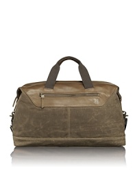 The Forge collection is rendered in wax-coated cotton canvas with leather trim accents and antiqued brass hardware for rugged appeal and utilitarian functionality. With vintage inspiration and artisan detailing, each bag is made to last and performs well in numerous environments. The satchel offers a classic shape with excellent organization pockets and works beautifully for overnight trips and weekend getaways. The Forge collection is rendered in wax-coated cotton canvas with leather trim accents and antiqued brass hardware for rugged appeal and utilitarian functionality. With vintage inspiration and artisan detailing, each bag is made to last and performs well in numerous environments. The satchel offers a classic shape with excellent organization pockets and works beautifully for overnight trips and weekend getaways.