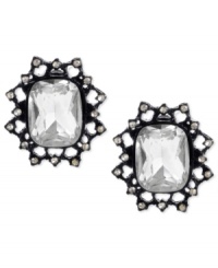 Burst onto the scene with this pair of stud earrings from Betsey Johnson. Crafted from black-plated mixed metal, the earrings glisten with glass crystal accents and feature a bold filigree pattern. Approximate drop: 3/4 inch. Burst onto the scene with this pair of stud earrings from Betsey Johnson. Crafted from black-plated mixed metal, the earrings glisten with glass crystal accents and feature a bold filigree pattern. Approximate drop: 3/4 inch.