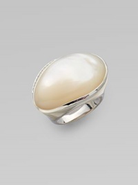 A shimmering mother of pearl cabochon, edged in diamonds, on sterling silver.Diamonds, .11 tcw Mother of pearl cabochon Sterling silver Width, about 1¼ Imported