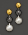 A triple drop earring from Gurhan, designed with hammered 24 Kt. yellow gold with white silver and dark silver discs.