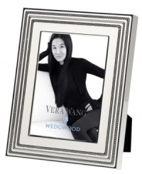 Add new elegance to beautiful memories with Vera Wang's With Love Blanc picture frame. Geometric detail lends metallic shimmer to creamy white enamel in a home accent that invokes modern and deco design. Add new elegance to beautiful memories with Vera Wang's With Love Blanc picture frame. Geometric detail lends metallic shimmer to creamy white enamel in a home accent that invokes modern and deco design.