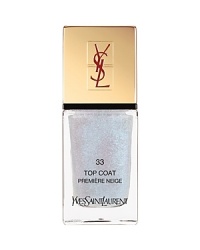 This limited-edition shimmering top coat can be worn to add sparkle and magic to your favorite La Laque Couture shade, or worn alone for a sophisticated and discreet shimmer. A new generation nail lacquer that's both elegant and practical is presented in a sleek, elongated glass bottle imprinted with the timeless YSL logo. A pantheon of fashion-inspired shades, from subtle and natural to vibrant and dramatic, provide a high-shine finish for an instant touch of glamour. Long-wear formula with Chile Rose Oil strengthens, moisturizes and protects nails from chipping and cracking. Dries fast and applies evenly without streaking. La Laque Couture is equipped with a new custom-made brush that allows an easy and fast application. The nail lacquer perfectly adheres to the brush, which pulls the drop instead of pushing it, for a flawless and intense result. This limited-edition shimmering top coat can be worn to add sparkle and magic to your favorite La Laque Couture shade, or worn alone for a sophisticated and discreet shimmer. A new generation nail lacquer that's both elegant and practical is presented in a sleek, elongated glass bottle imprinted with the timeless YSL logo. A pantheon of fashion-inspired shades, from subtle and natural to vibrant and dramatic, provide a high-shine finish for an instant touch of glamour. Long-wear formula with Chile Rose Oil strengthens, moisturizes and protects nails from chipping and cracking. Dries fast and applies evenly without streaking. La Laque Couture is equipped with a new custom-made brush that allows an easy and fast application. The nail lacquer perfectly adheres to the brush, which pulls the drop instead of pushing it, for a flawless and intense result.