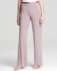 Calvin Klein Underwear accents these soft pajama pants with a stretchy satin waistband for luxurious comfort. Calvin Klein Underwear accents these soft pajama pants with a stretchy satin waistband for luxurious comfort.