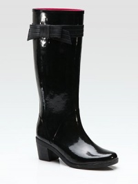 An ultra-feminine take on the classic wellie in waterproof vinyl, complete with a charming bow.Rubber heel, 2½ (65mm) Shaft, 13 Leg circumference, 15 Pull-on style Fabric lining Rubber sole ImportedOUR FIT MODEL RECOMMENDS ordering true whole size; ½ sizes should order the next whole size up. An ultra-feminine take on the classic wellie in waterproof vinyl, complete with a charming bow.Rubber heel, 2½ (65mm) Shaft, 13 Leg circumference, 15 Pull-on style Fabric lining Rubber sole ImportedOUR FIT MODEL RECOMMENDS ordering true whole size; ½ sizes should order the next whole size up.