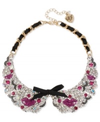 Grab a kiss from Betsey Johnson. This darling collar necklace showcases a gold tone chain intertwined with black grosgrain ribbon, black grosgrain ribbon bows, fuchsia glitter lips and clear crystal accents. Crafted in antiqued gold tone mixed metal. Approximate length: 15 inches + 3-inch extender. Approximate drop: 1-1/2 inches. Grab a kiss from Betsey Johnson. This darling collar necklace showcases a gold tone chain intertwined with black grosgrain ribbon, black grosgrain ribbon bows, fuchsia glitter lips and clear crystal accents. Crafted in antiqued gold tone mixed metal. Approximate length: 15 inches + 3-inch extender. Approximate drop: 1-1/2 inches.