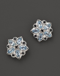A floral shaped applique stud earring in sterling silver, accented with blue topaz and black spinel. A floral shaped applique stud earring in sterling silver, accented with blue topaz and black spinel.