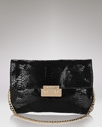 Add a bit of night magic to your look with Michael Michael Kor's glamorous patent python clutch. Add a bit of night magic to your look with Michael Michael Kor's glamorous patent python clutch.