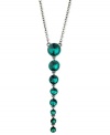 Teal appeal. This Y-shaped necklace from GUESS is crafted from hematite-tone mixed metal with glass crystal stones putting on a dazzling display. Item comes packaged in a signature GUESS Gift Box. Approximate length: 18 inches + 2-inch extender. Approximate drop: 4 inches.