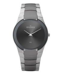 Exquisitely contemporary, this watch by Skagen Denmark is a modern masterpiece. Stainless steel bracelet with black plating at center links and round case with four lugs at bezel. Brushed charcoal dial features two silver tone hands and logo. Quartz movement. Water resistant to 30 meters. Limited lifetime warranty. Exquisitely contemporary, this watch by Skagen Denmark is a modern masterpiece. Stainless steel bracelet with black plating at center links and round case with four lugs at bezel. Brushed charcoal dial features two silver tone hands and logo. Quartz movement. Water resistant to 30 meters. Limited lifetime warranty.