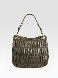 Supple leather in a signature ruched design with buckle detail and an adjustable strap.Adjustable shoulder strap, 9-9¾ dropTop zip closureOne inside zip pocketThree inside open pocketsSignature jacquard lining14W X 13H X 5¼DMade in Italy Supple leather in a signature ruched design with buckle detail and an adjustable strap.Adjustable shoulder strap, 9-9¾ dropTop zip closureOne inside zip pocketThree inside open pocketsSignature jacquard lining14W X 13H X 5¼DMade in Italy
