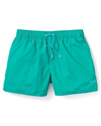 These short swim trunks are your ticket to warm weather fun, and their bright color matches the vibrancy of the season, full of sunny days, beach volleyball and backyard barbeques. These short swim trunks are your ticket to warm weather fun, and their bright color matches the vibrancy of the season, full of sunny days, beach volleyball and backyard barbeques.