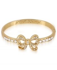 Wrap up your wish list with this adorable hinge bangle bracelet from Betsey Johnson. A bow design is prettied up with crystal accents. Includes signature gift box (4 diameter). Crafted in antique gold tone mixed metal. Approximate diameter: 2-1/3 inches. Wrap up your wish list with this adorable hinge bangle bracelet from Betsey Johnson. A bow design is prettied up with crystal accents. Includes signature gift box (4 diameter). Crafted in antique gold tone mixed metal. Approximate diameter: 2-1/3 inches.