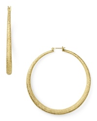 These ABS by Allen Schwartz gold hoops dazzle the classic silhouette with a distinctive shimmery texture. These ABS by Allen Schwartz gold hoops dazzle the classic silhouette with a distinctive shimmery texture.