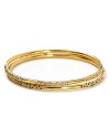 Melinda Maria's set of three gold bangles are a perfect complement to breezy bohemian looks. Wear the stack solo, or copy the cool-girls with a gilded wristful.