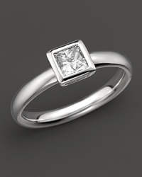 A sophisticated diamond ring with bezel-set, princess-cut stone. A sophisticated diamond ring with bezel-set, princess-cut stone.