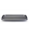 More cookies, please! Easily turn out batch after batch of your scrumptious best with Anolon's 10 x 15 cookie sheet. New proprietary coating ensures superior release and makes cleanup a snap. Silicon-enhanced handles are steady and slip-free, while the pan's substantial weight provides durability and helps prevent warping.