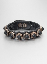 An edgy design featuring cross-stitched details on a supple leather cuff. LeatherRose goldtoneLength, about 7Studded closureImported An edgy design featuring cross-stitched details on a supple leather cuff. LeatherRose goldtoneLength, about 7Studded closureImported