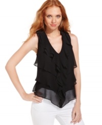 Ruffled tiers make this DKNY Jeans blouse utterly feminine. Pair it with white jeans for an on-trend ensemble. Ruffled tiers make this DKNY Jeans blouse utterly feminine. Pair it with white jeans for an on-trend ensemble.
