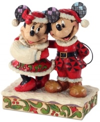 Old Saint Mick! Dressed up in a folksy take on Santa's red suit, Mickey celebrates the joy and jubilation of Christmas with his Mrs. Claus. Mickey's and Minnie's signature mouse ears get a glimmering, eye-catching update that plays with the whimsical shapes & designs on this figurine. Old Saint Mick! Dressed up in a folksy take on Santa's red suit, Mickey celebrates the joy and jubilation of Christmas with his Mrs. Claus. Mickey's and Minnie's signature mouse ears get a glimmering, eye-catching update that plays with the whimsical shapes & designs on this figurine.