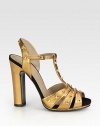 Metallic leather sandal with a hidden platform and goldtone metal studs. Self-covered heel, 4¾ (120mm)Hidden platform, ¾ (20mm)Compares to a 4 heel (100mm)Metallic leather upper with metal studsLeather lining and solePadded insoleMade in Italy