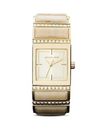 This Michael Kors watch in a light champagne and gold color adds an instant elegance to your look. It's perfect for dressier occasions, but can easily be worked into your wardrobe as an everyday piece. This Michael Kors watch in a light champagne and gold color adds an instant elegance to your look. It's perfect for dressier occasions, but can easily be worked into your wardrobe as an everyday piece.