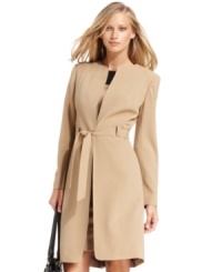 Calvin Klein creates a minimalist masterpiece with this collarless coat. The elongated hem makes it perfect for pairing with skirts and dresses, too. Calvin Klein creates a minimalist masterpiece with this collarless coat. The elongated hem makes it perfect for pairing with skirts and dresses, too.
