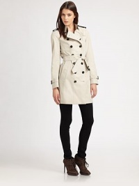 Classic trench styling, elevated with leather details.Braided leather epaulettesFoldover collarDouble-breasted button frontSelf beltSide slash pocketsButton cuffsButton rainflapBack ventFully linedAbout 34 from shoulder to hemCottonImportedModel shown is 5'10 (177cm) wearing US size 4. Classic trench styling, elevated with leather details.Braided leather epaulettesFoldover collarDouble-breasted button frontSelf beltSide slash pocketsButton cuffsButton rainflapBack ventFully linedAbout 34 from shoulder to hemCottonImportedModel shown is 5'10 (177cm) wearing US size 4.