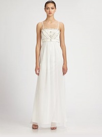 This regal, beaded design features delicate shoulder straps and a gauzy, floor-length skirt.Adjustable spaghetti strapsBeaded bodiceEmpire waistConcealed side zipFully linedAbout 45 from natural waist80% polyester/20% nylonSpot cleanImportedModel shown is 5'11 (180cm) wearing US size 4. This regal, beaded design features delicate shoulder straps and a gauzy, floor-length skirt.Adjustable spaghetti strapsBeaded bodiceEmpire waistConcealed side zipFully linedAbout 45 from natural waist80% polyester/20% nylonSpot cleanImportedModel shown is 5'11 (180cm) wearing US size 4.
