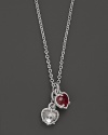 A twin heart necklace in crystal and red corundum framed in sterling silver. Designed by Judith Ripka.